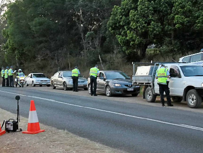 Police interview drivers on Cedar Pocket Rd on Thursday night.